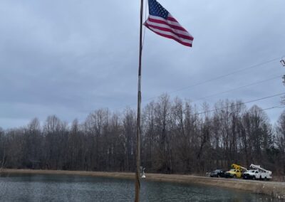 american flag by pond in troy, va trinity repair & restoration auto repair